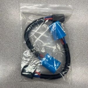 Coiled electrical cable in plastic packaging.