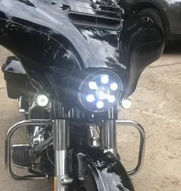 Close-up of a motorcycle's front light assembly with multiple LED bulbs.