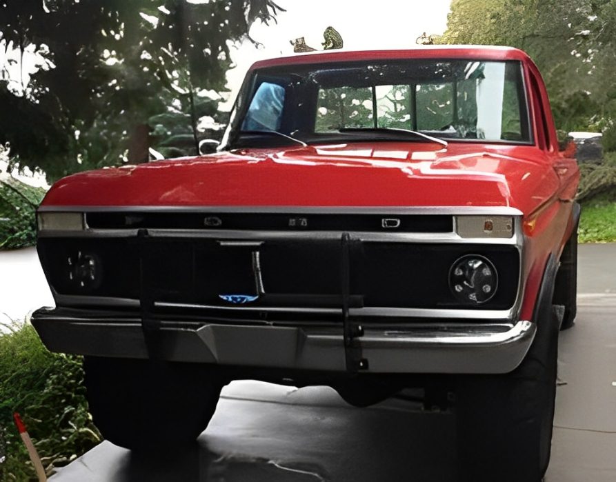 Classic red Ford pickup truck parked outdoors.